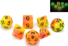 Load image into Gallery viewer, Yellow and Orange dual colour glow in the dark dice set 7 piece